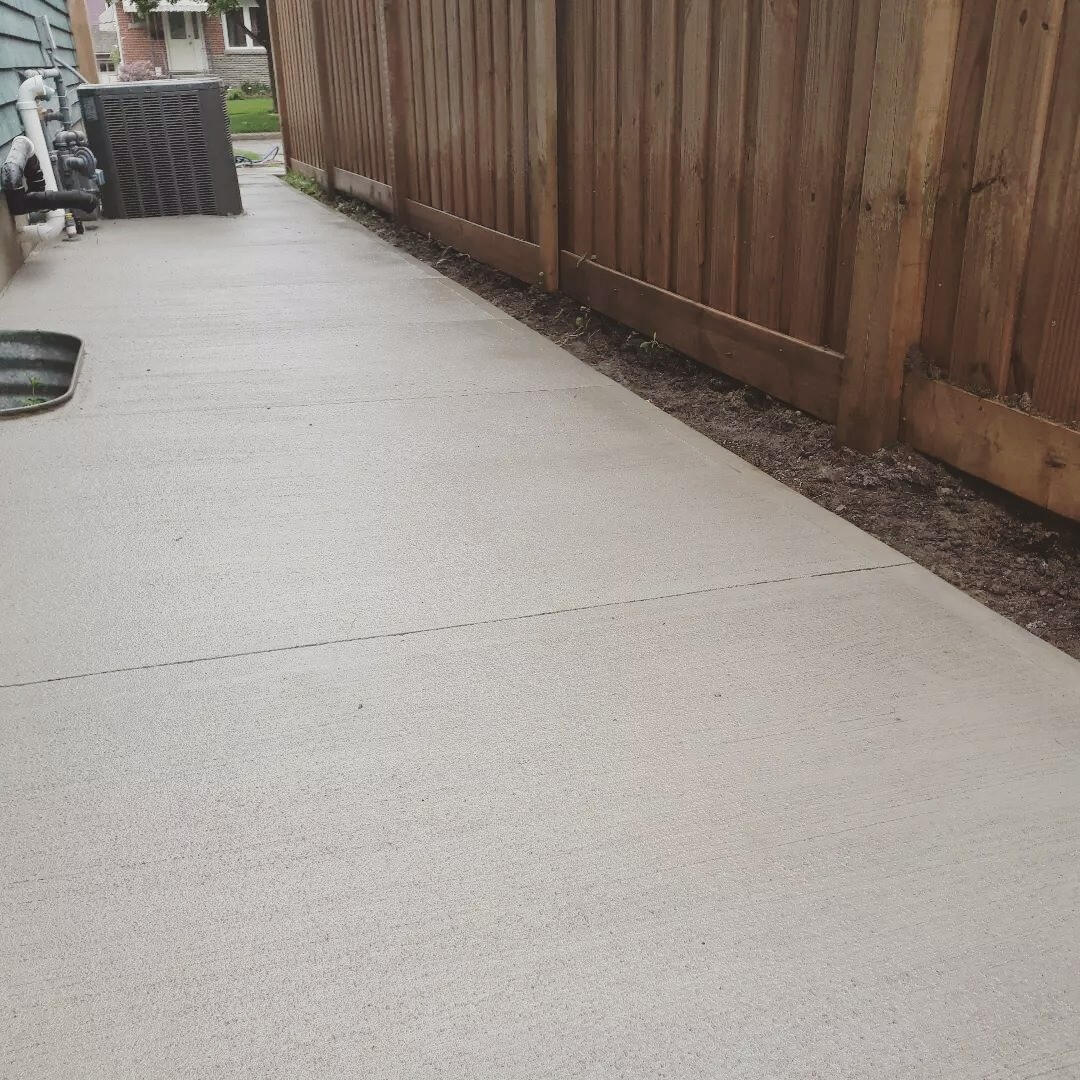 Concrete Walkway On Side of House